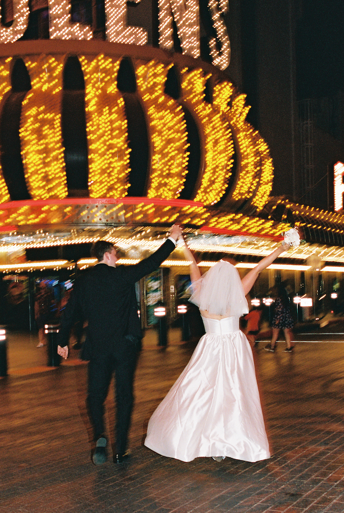 couple celebrating in front of casino 