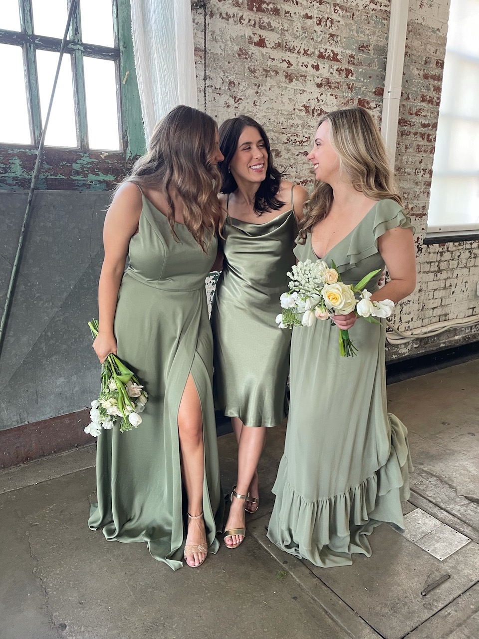 3 bridesmaids in light green bridesmaid dresses