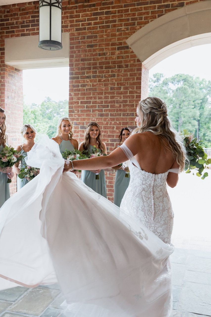 bride and bridesmaids first look